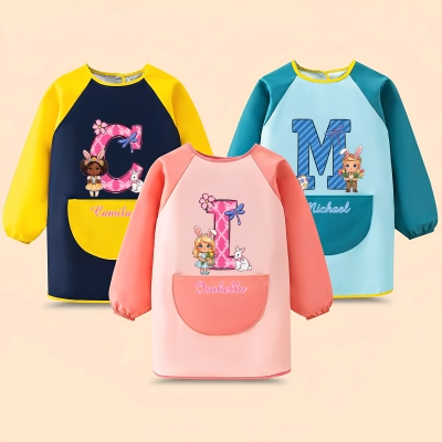Personalisierte Malschürze mit Cartoon-Motiv für Kinder (Junge/Mädchen) mit langen Ärmeln, inklusive Tasche, ideal als Geburtstags- oder Ostergeschenk.