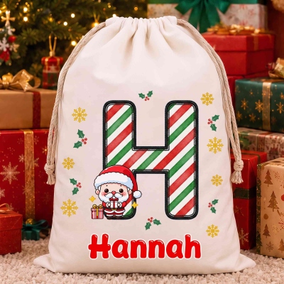 Custom Name Cute Cartoon Santa Claus Alphabet Christmas Gift Bag, Large Capacity Canvas Santa Sack with Drawstring, Christmas Gift for Kids/Family