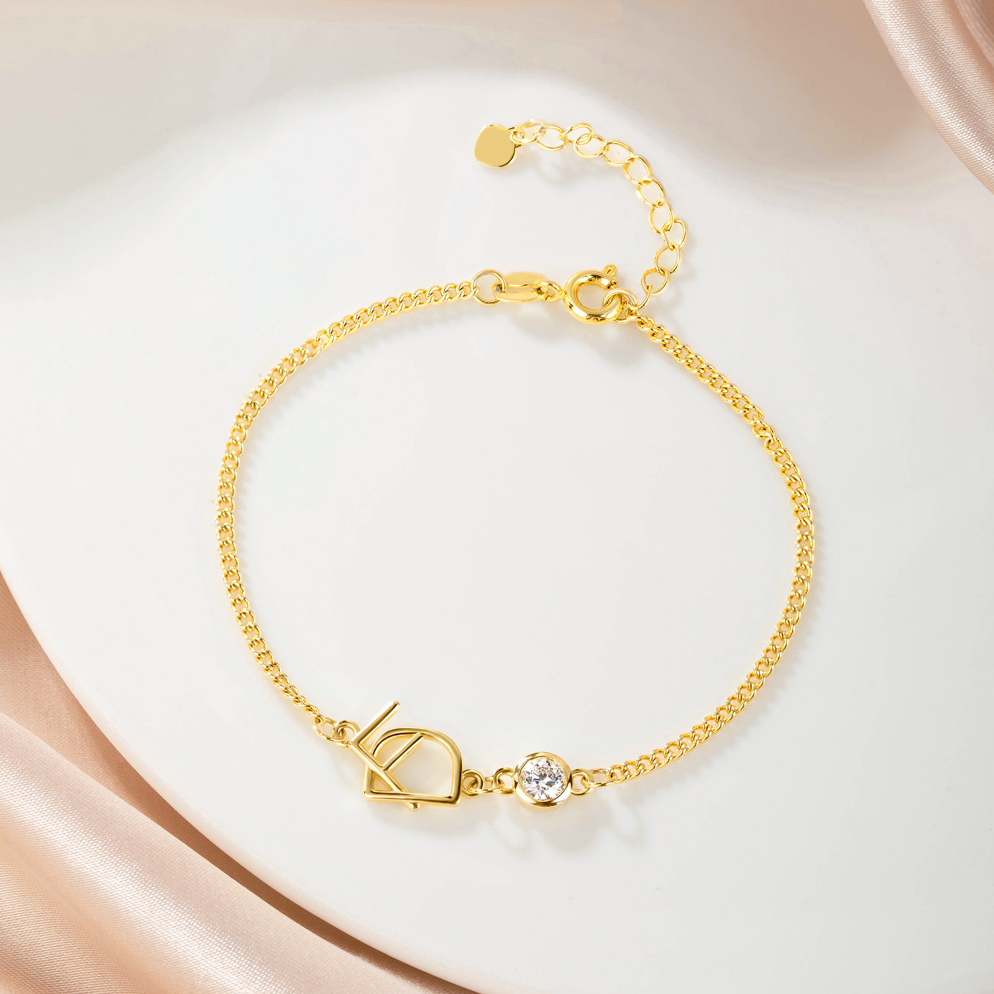 Interlocking Letters Curb Chain Bracelet