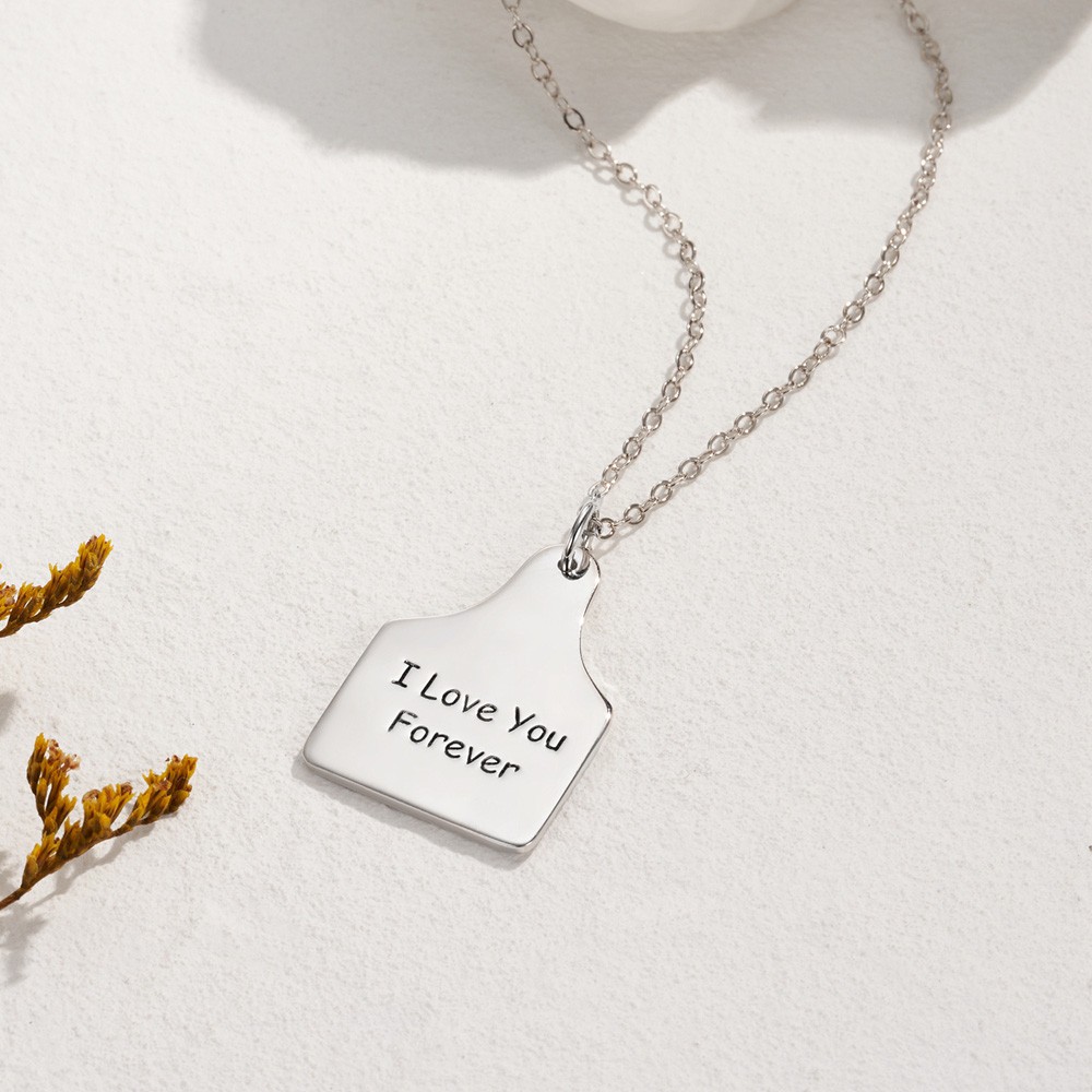 cow tag pendant